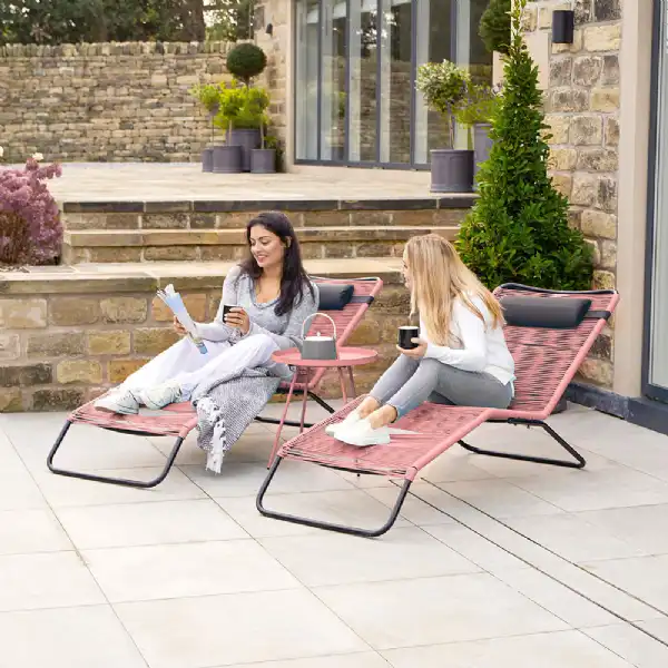 https://www.homeliving.co.uk/imagecache/sq600-18-270-PI-Pink-Metal-and-Poly-String-Garden-2-Piece-Sun-Loungers.webp?v=01082023170138